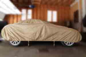 Car in garage with cover